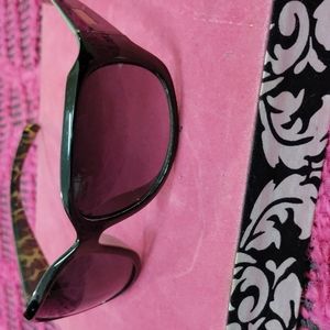 Nine west sunglasses solid black on the outside and Leopard print on the inside.